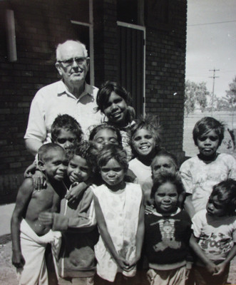 Fr Kevin McKelson with children at LaGrange, 1980